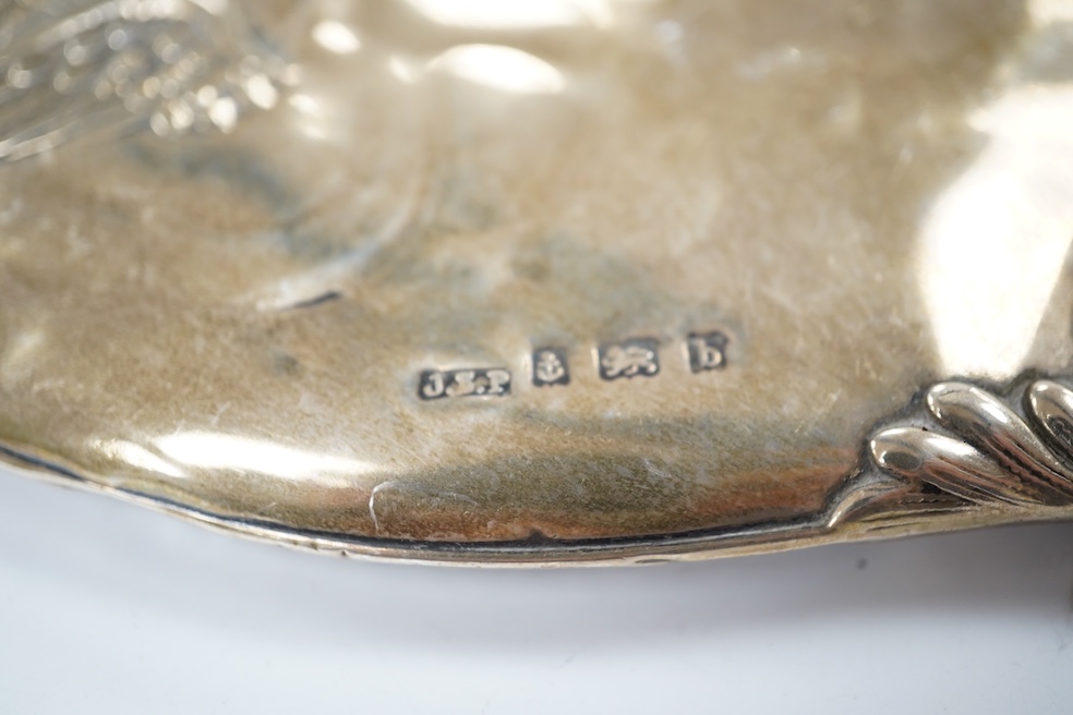 An Edwardian silver mounted four piece mirror and brush set, Birmingham, 1901. Condition - poor